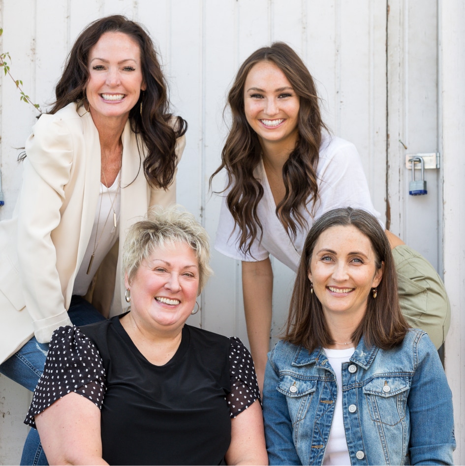 Smiling team of four skilled dentists in Stillwater, MN, posing together for a photo.