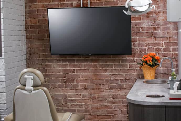 Dental chair and a monitor in a dental clinic in Stillwater MN