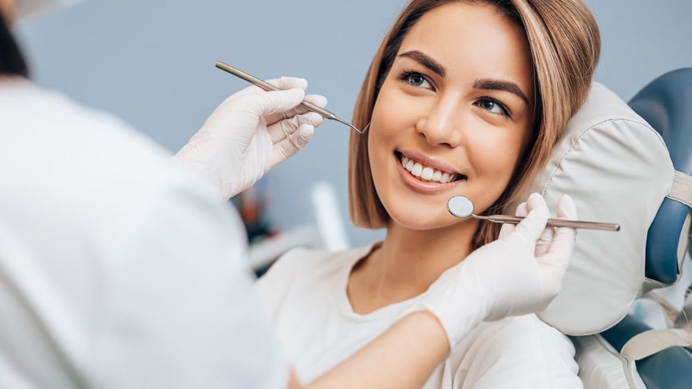 Woman receiving periodontal therapy from her dentist in Stillwater, MN